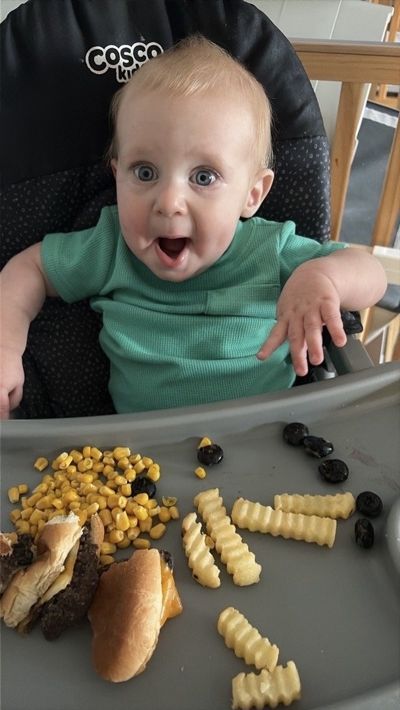 Infant enjoying a healthy lunch at Sprouts