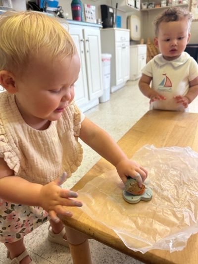 Toddlers exploring a hands-on sensory art activity